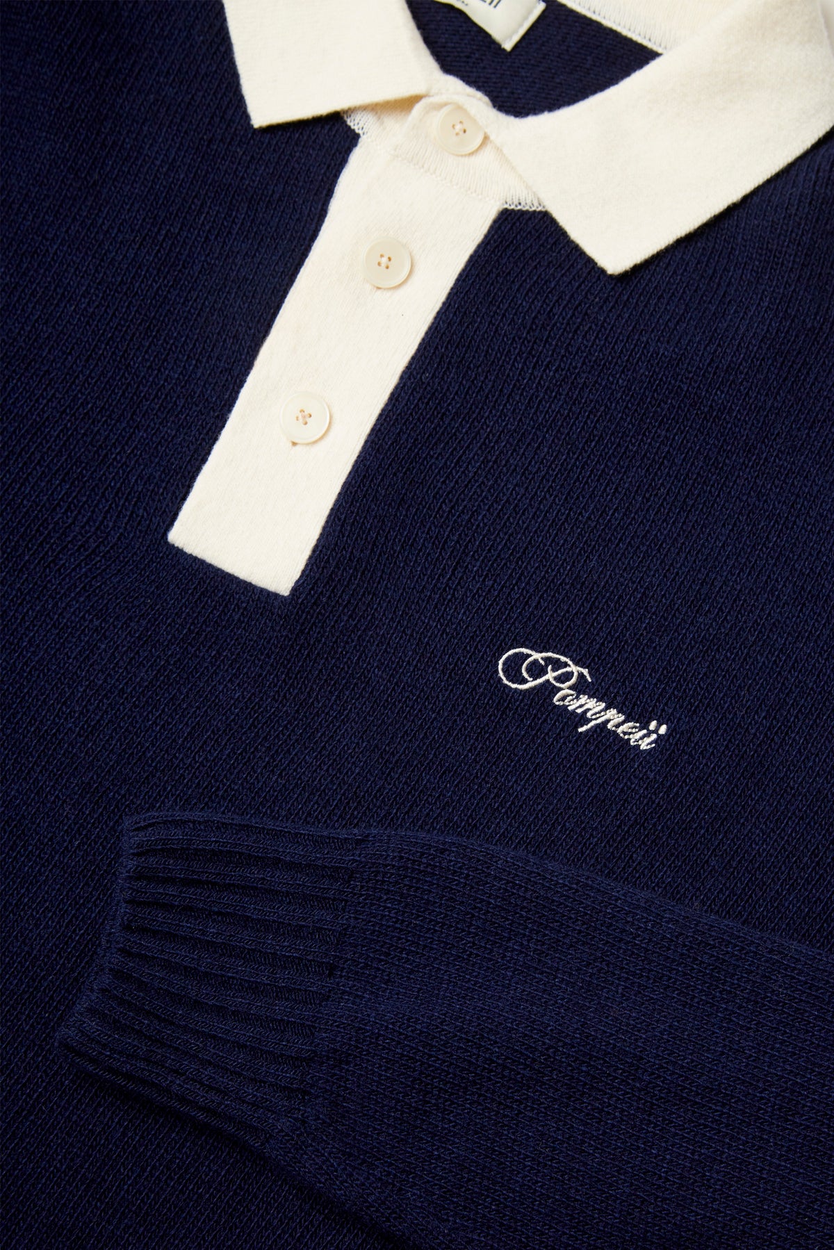 POLO EN LAINE TRICOTÉE MARINE AVEC LOGO